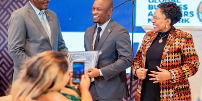 Vice President Kembo Mohadi (far left) and Women Affairs, Community, Small and Medium Enterprises Development Minister Senator Monica Mutsvangwa (far right) present the Global Business Achievers Network Platinum Award to Hon Dr Martin Muduva (centre) during the GBAN Awards Ceremony held in Harare recently.
