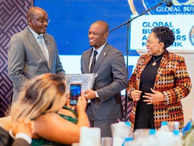 Vice President Kembo Mohadi (far left) and Women Affairs, Community, Small and Medium Enterprises Development Minister Senator Monica Mutsvangwa (far right) present the Global Business Achievers Network Platinum Award to Hon Dr Martin Muduva (centre) during the GBAN Awards Ceremony held in Harare recently.